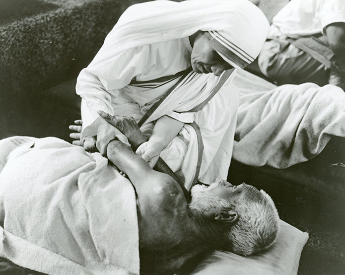 Image result for picture mother teresa embrace a dying man