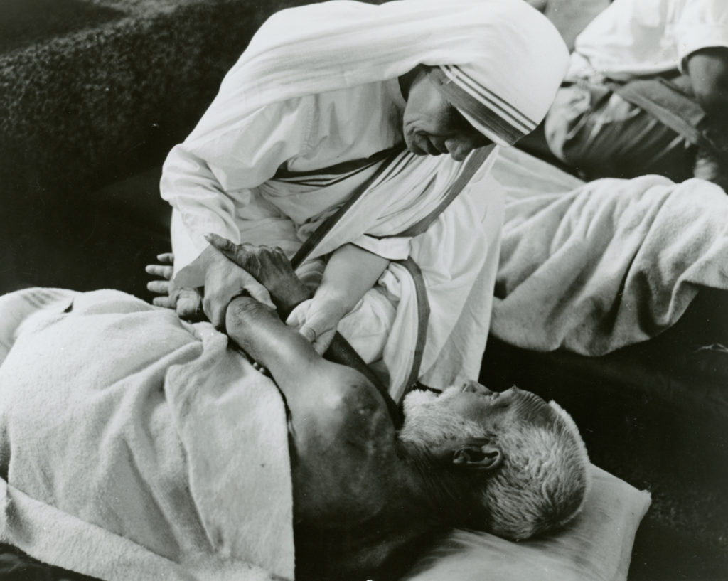Blessed Teresa of Kolkata cares for a sick man in an undated photo. (CNS photo/KNA) 