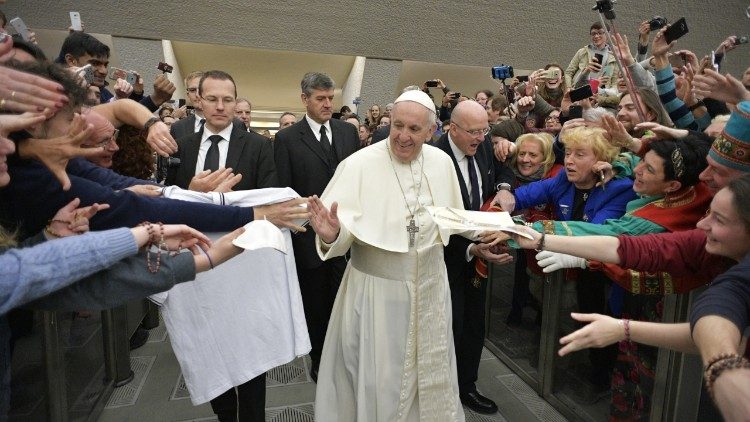 Pope Francis greets pilgrims in the Paul VI Hall